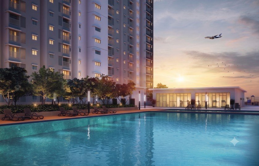 Alanis Residence — swimming pool and clubhouse at dusk